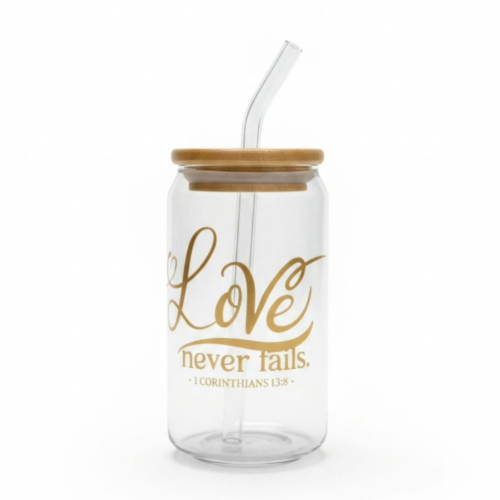 Love never fails glass cup with bamboo lid and glass straw featuring a Christian design