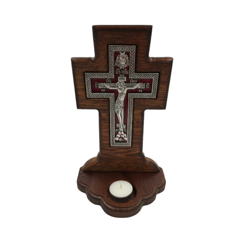 Wooden crucifix with silver-toned metal relief of Jesus Christ, deep red background and built-in tealight candle holder