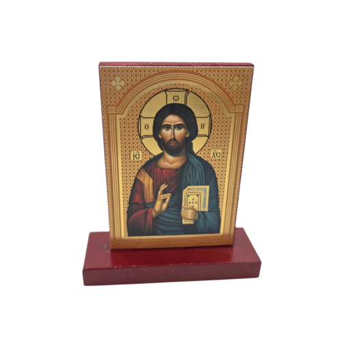 Small wooden icon of Jesus Christ with a warm gold background and wooden base
